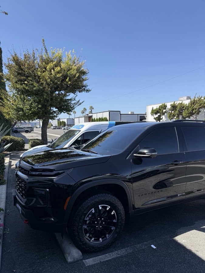 Black Chevy Traverse with glossy paint